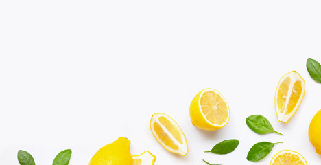 Fresh lemon and  slices  with leaves isolated on white.