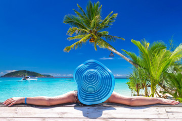 Woman in hat at beautiful Caribbean sea, Mexico