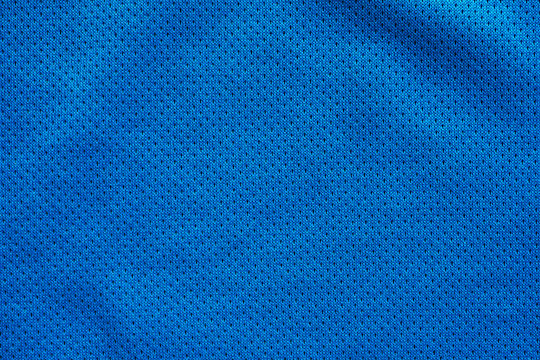 Blue fabric sport clothing football jersey with air mesh texture background