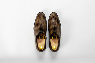 Classic male leather shoes. Isolated on white background. Top view