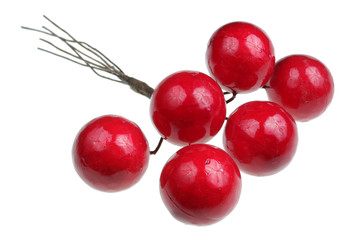 Red plastic berries to decorate Christmas installations isolated macro