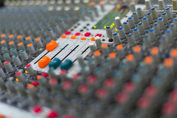 Obraz premium Analog sound mixer with selected focus. Professional audio mixing console radio and television broadcasting. Horizontal shot.