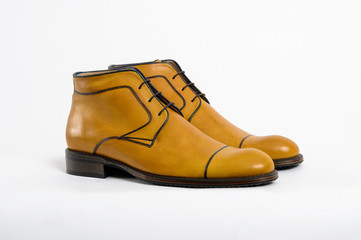 Classic men's shoes on a white isolated background. Angle view from the front