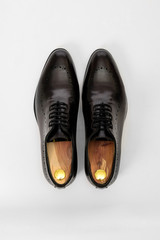 Classic male leather shoes. Isolated on white background. Top view