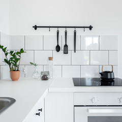 Fototapeta na wymiar Contemporary kitchen with white tiles