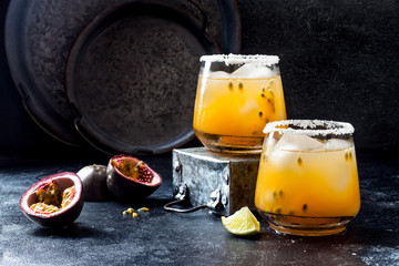 Mango passionfruit margarita cocktail with lime. Tropical alcoholic drink for summer party - obrazy, fototapety, plakaty