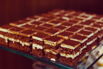 Selection of decorative desserts on a buffet table at a catered luxury event or celebration