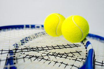 tennis ball and racket on white background