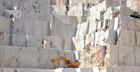 Marble quarry with a Excavator loader, open mining, Italy - obrazy, fototapety, plakaty