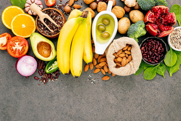 Ingredients for the healthy foods selection  .The concept of healthy food set up on dark concrete background copy space.