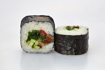 sushi in nori leaves with salmon cucumbers avocado cheese