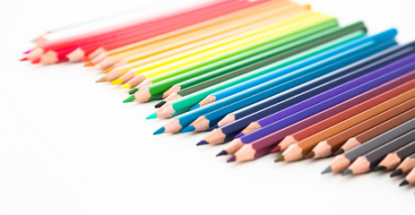 colored pencils lying in irregular row