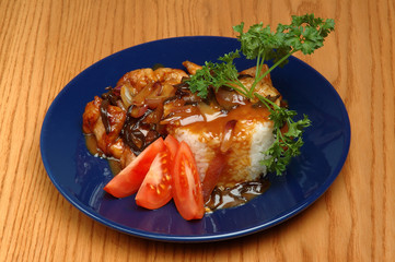 Seafood platter with rice and parsley on a blue plate