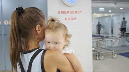Mom and child come in in the emergency room at the hospital in Pattaya Thailand.