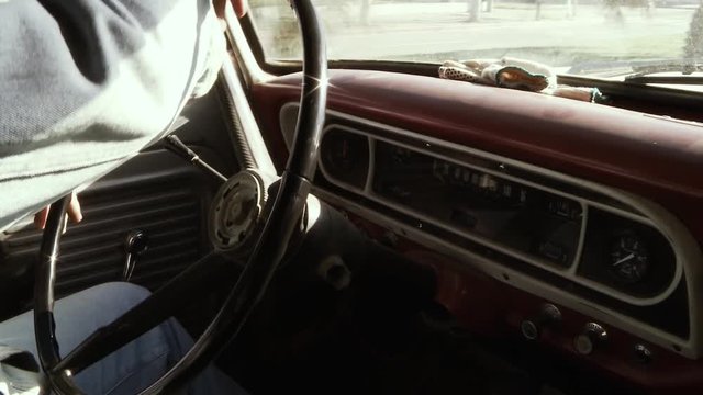 Man Driving Vintage Pickup Truck. Side View. Close Up.