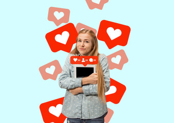 Social media interactions on mobile phone. Internet digital marketing, Chating, commenting, liking. Smiles and icons above tablet screen, that holding by young woman on blue studio background.
