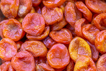 Dried apricots in the store, closeup. Background. Space for text.