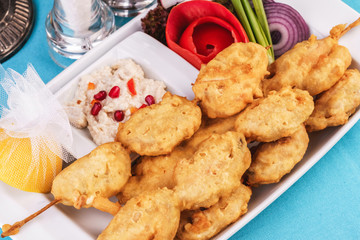 European cuisine, Mediterranean dish. Whole crab legs, crab meat fried in batter on butter, beer snack with creamy mustard sauce