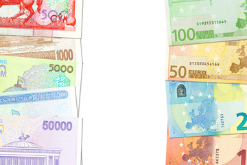 some Uzbek Som banknotes and Euro banknotes indicating bilateral economic relations with copy space