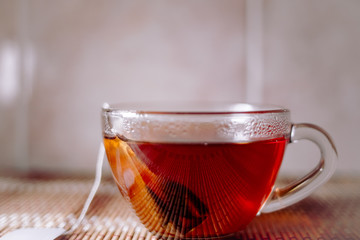 tea in a clear glass black