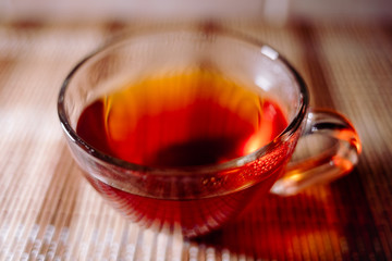 tea in a clear glass black
