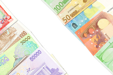 some Uzbek Som banknotes and Euro banknotes indicating bilateral economic relations with copy space