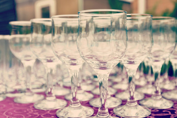 Beautiful champagne glasses defocused on buffet table in restaurant and blurred background