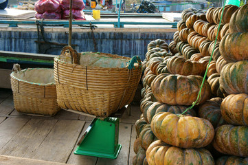 wooden boat transport many yellow pumpkins, Cai Rang floating market, Mekong Delta