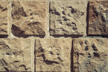 Building wall is lined with stone slabs