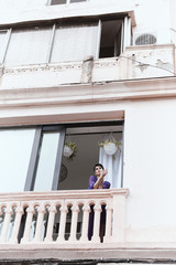 female with short haircut poses in Tbilisi loft
