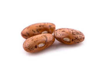 Pile of pinto beans isolated on white