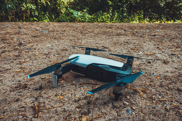 small drone lying on the ground