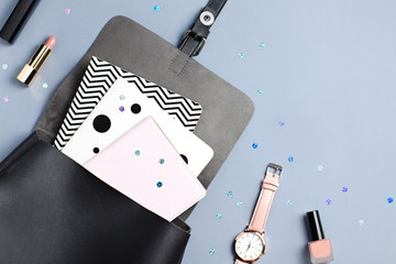 Black leather backpack, stationery and note books, back to school concept. Copy space, top view