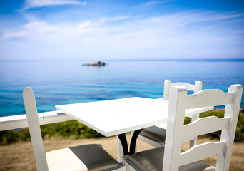 Table background with beautiful blue ocean and sandy beach view. Summer sunny day.