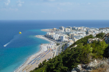 View over Rhodes town, beach and parasailing  from the Temple of Athena Polias and Zeus Polieus, Rhodes, Greece