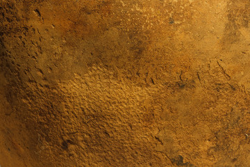 A fragment of an old clay pot. The surface of the ceramic product. Texture. Close-up. The small depth of field