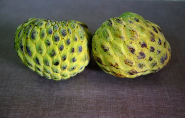 Sugar apple or custard apple with slice isolated on the background, exotic tropical Thai annona or cherimoya fruit, healthy food