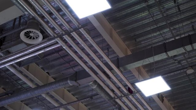hvac system ventilation pipes on ceiling of big industrial building