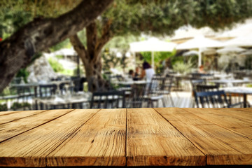 Table background  in a restaurant outdoor view. Empty  space for your decoration and an advertising product.
