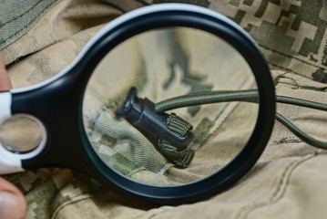 black magnifier increases the spotted camouflage fabric with lace on clothes