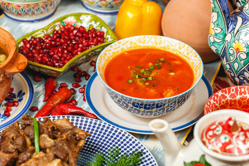 Uzbek national tomato soup of beef and potatoes with greens