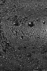 Natural dark silvery black water dew drops texture macro background vertical textured wet vapour bubble splashes pattern copy space silver glossy drop detail large detailed droplet closeup droplets