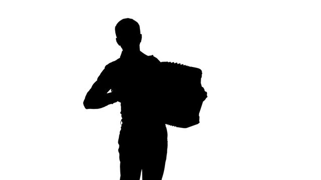 man musician plays the accordion masterly in the studio, black silhouette on a white background,isolated,close-up