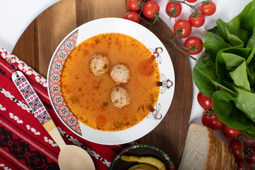 Top view of plate with meatballs soup, traditional plate of the Romanian cuisine, ciorba de perisoare
