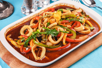 Laghman is a national dish. Home-made noodles stewed with green and red peppers, vegetables, squid rings, beef. Caucasian cuisine, Mediterranean food