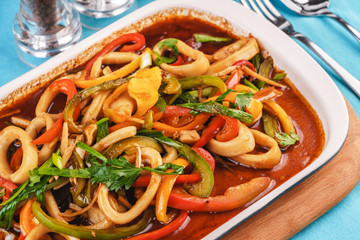 Laghman is a national dish. Home-made noodles stewed with green and red peppers, vegetables, squid rings, beef. Caucasian cuisine, Mediterranean food