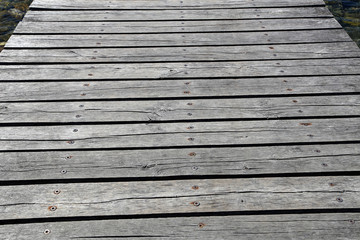 Obraz premium Decorative background of old wooden bridge floor