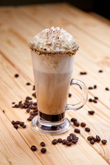 cup of coffee on the wooden background