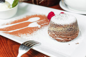 cake made of cottage cheese, poured with sweet sauce and berries