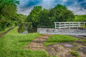 View of a British canal lock in rural setting